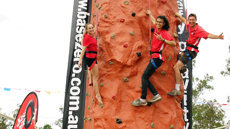 Young people rock climbing