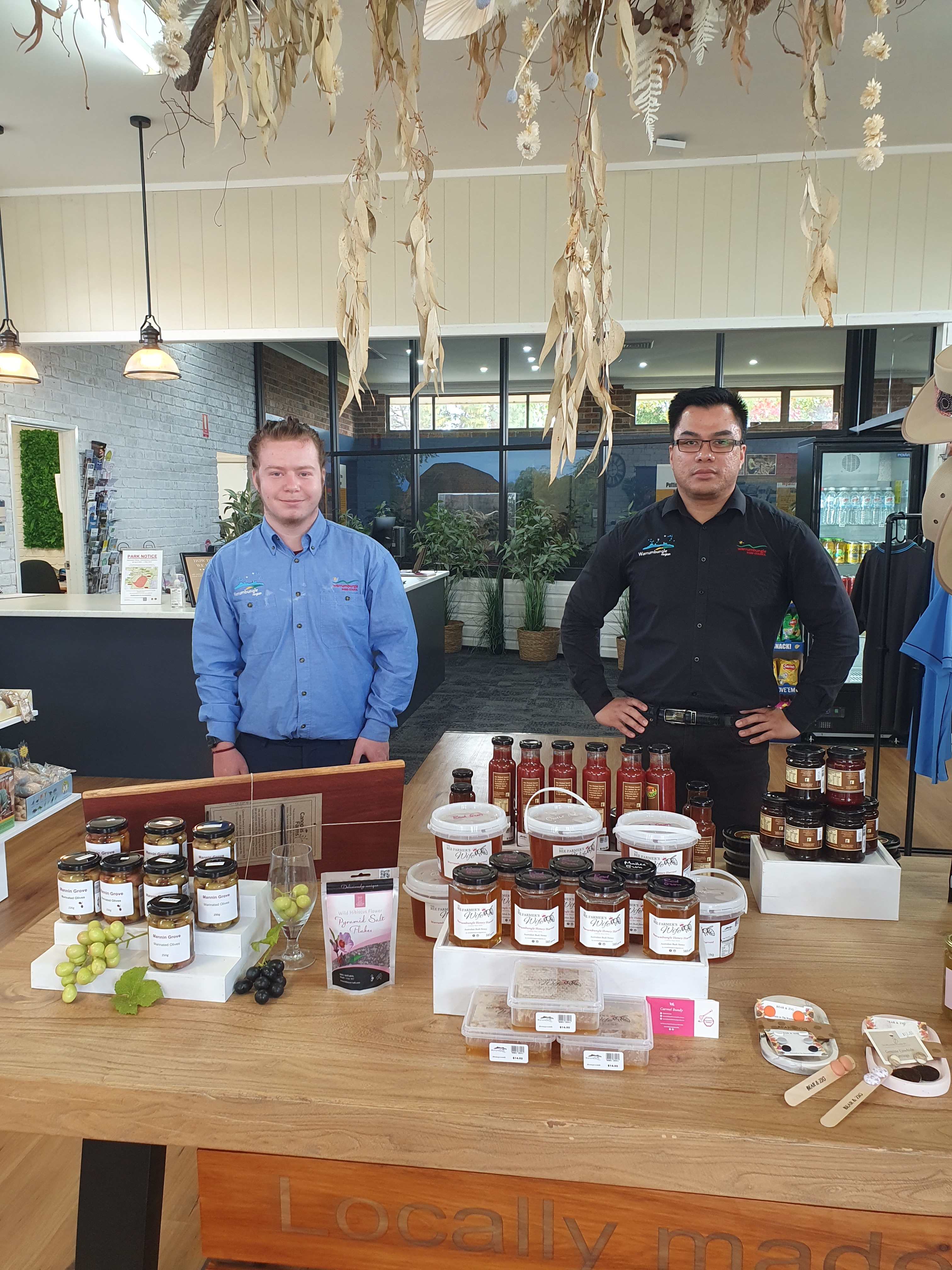 Visitor Information Centre interior with work experience student and Manager